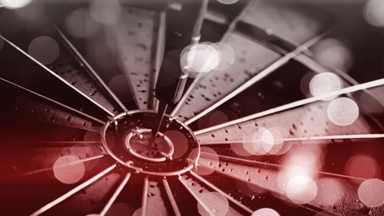 Arrow in a dart board bullseye