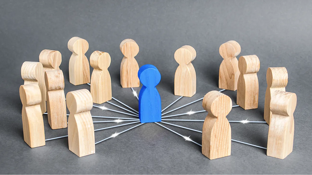 One blue wooden figure connected to tan wooden figures