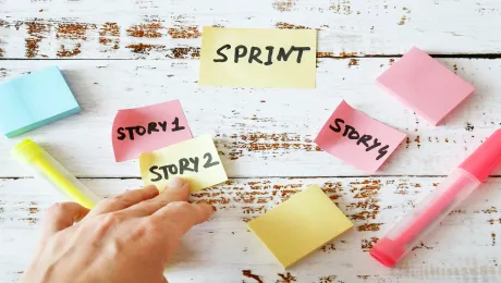 Colorful notes with "story" written on them and a person's hand